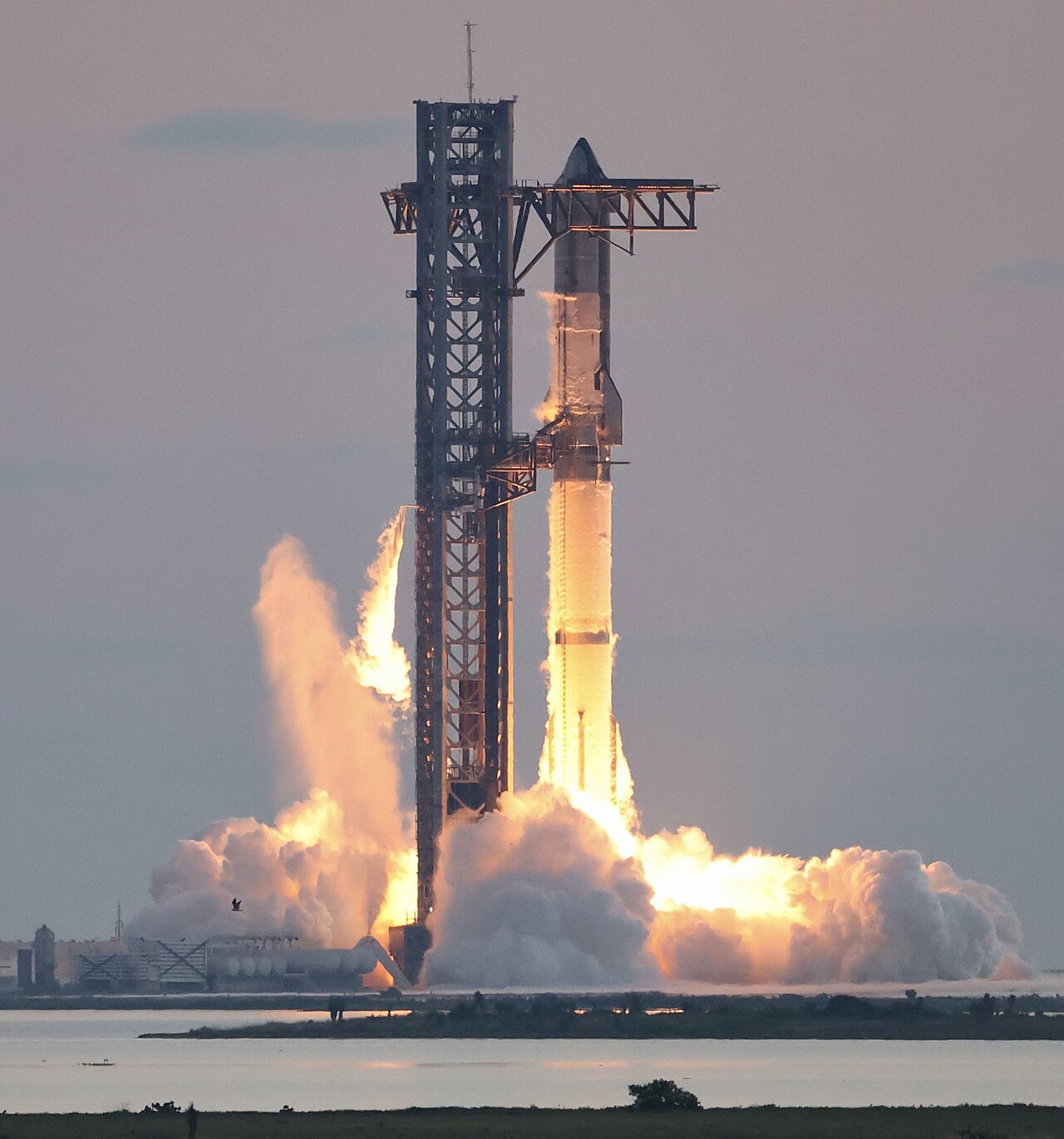 SpaceX Starship igniting its Raptor engines during a test flight, the key to next-generation launch economics