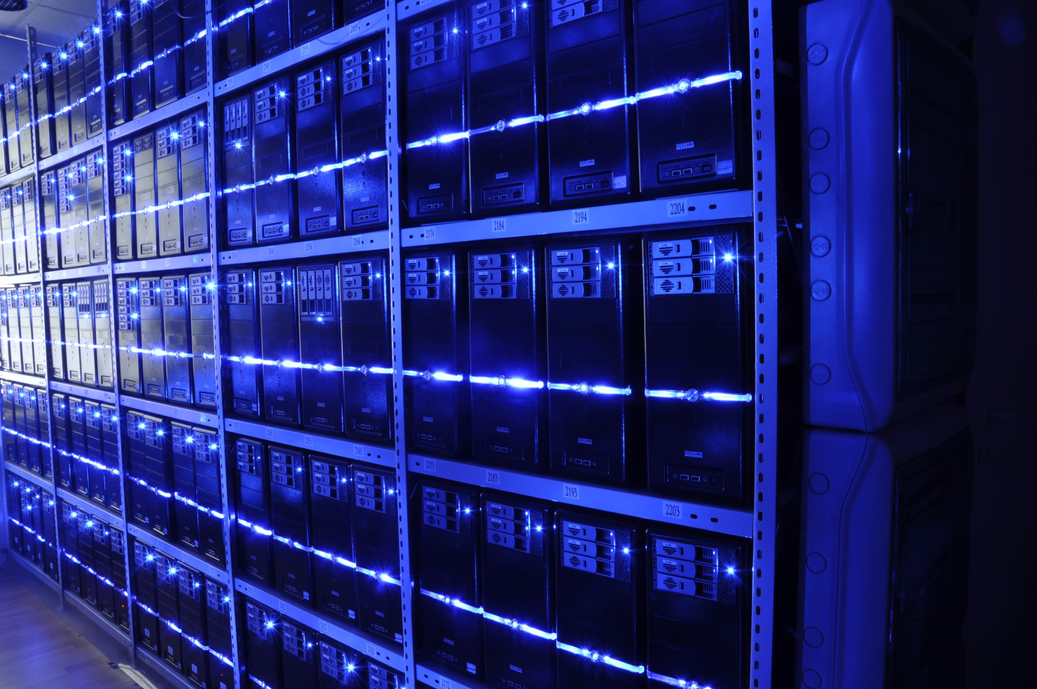 Data center server aisle where CXL memory pooling disaggregates DRAM across racks